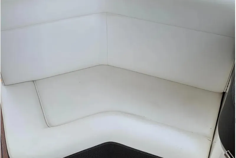 Slide: The Image of White leather seating on a 2018 Sea Ray SLX 310 boat. - 23
