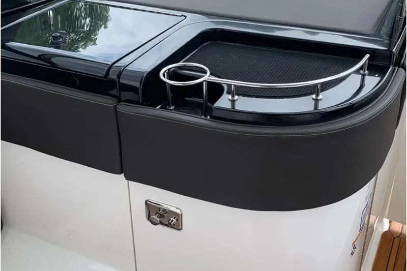 Slide: The Image of 2018 Sea Ray SLX 310 boat interior with sleek black and white design. - 29