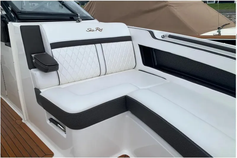 Slide: The Image of Luxurious seating on 2018 Sea Ray SLX 310 boat with white and black upholstery. - 5