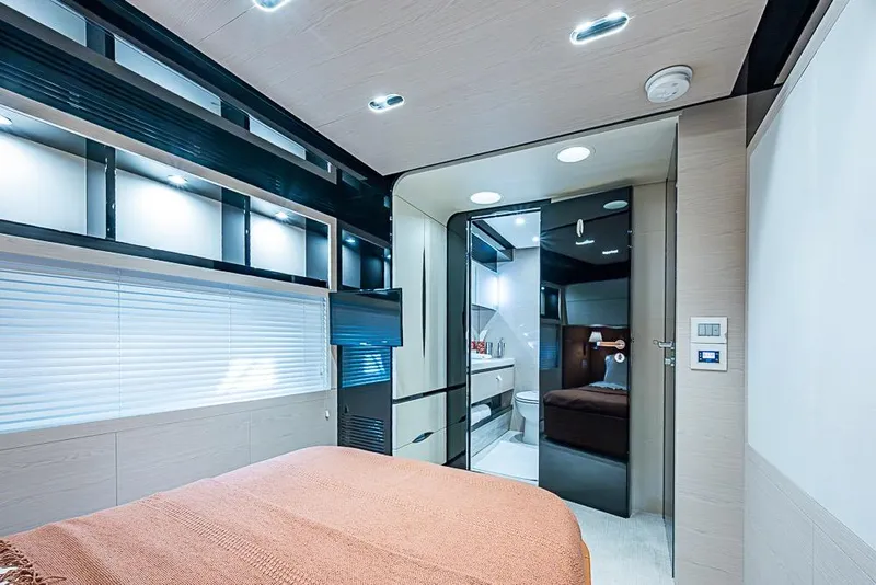 Slide: The Image of Luxurious interior of 2017 Azimut 80 yacht featuring modern bedroom and ensuite bathroom. - 100