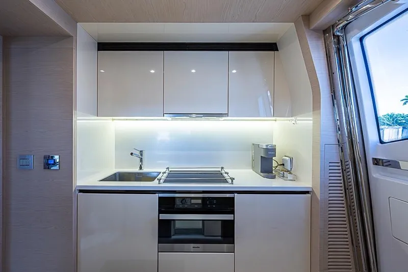Slide: The Image of Modern kitchen interior on 2017 Azimut 80 yacht, featuring sleek cabinetry and appliances. - 63