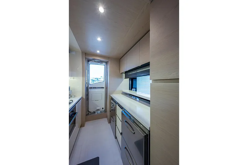 Slide: The Image of Modern kitchen interior of 2017 Azimut 80 yacht with sleek cabinetry and stainless steel appliances. - 65