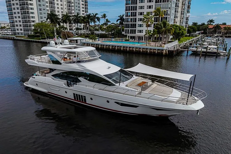 Slide: The Image of Luxury 2017 Azimut 80 yacht cruising near waterfront buildings and marina. - 8