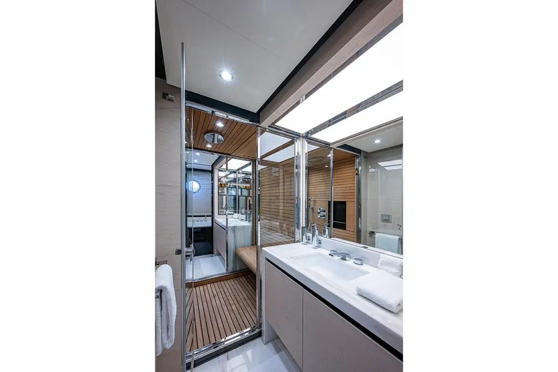 Slide: The Image of Luxurious bathroom interior of 2017 Azimut 80 yacht with modern fixtures and wooden accents. - 88