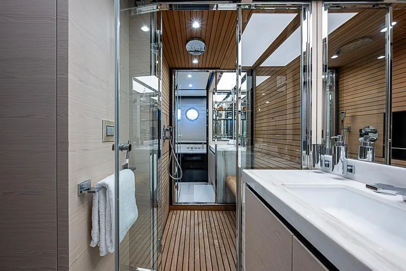 Slide: The Image of Luxurious bathroom interior of 2017 Azimut 80 yacht with modern fixtures and wooden accents. - 89