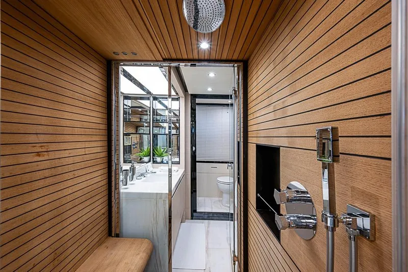 Slide: The Image of Luxurious bathroom interior of 2017 Azimut 80 yacht with wood paneling and modern fixtures. - 92