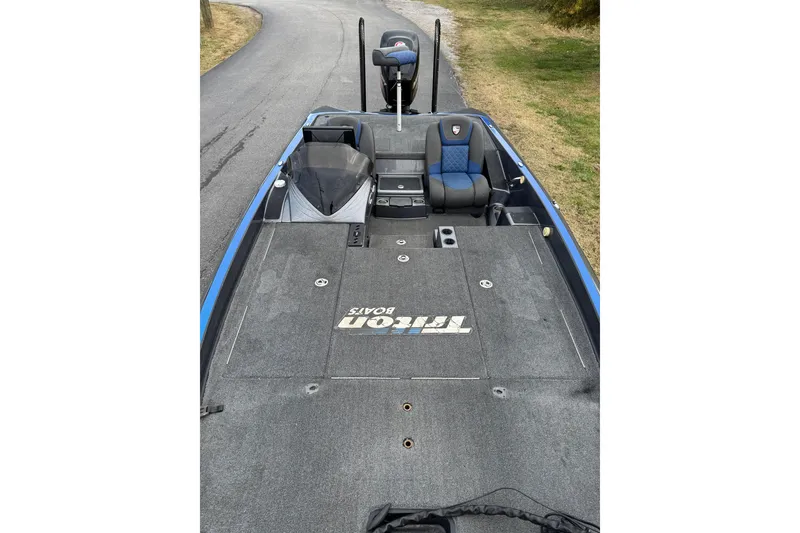 Slide: The Image of 2017 Triton 20 TrX Patriot boat interior with seating and storage compartments. - 4