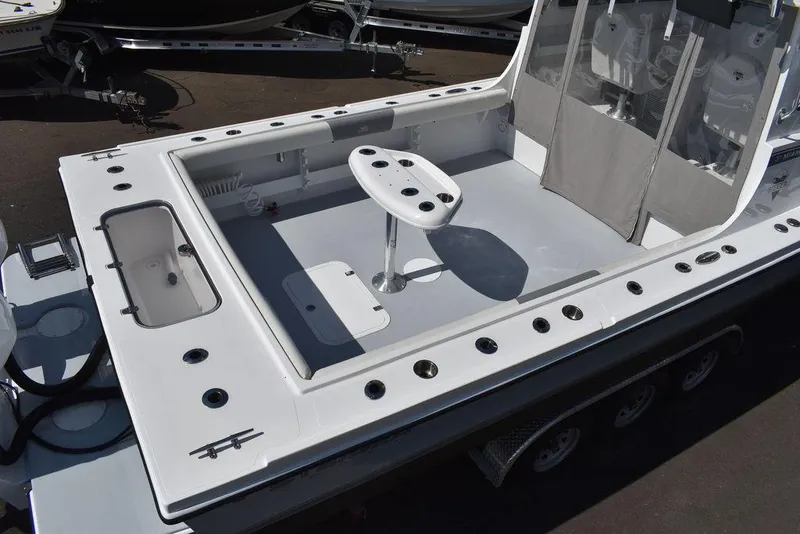 Slide: The Image of 2023 Steiger Craft 31 Miami boat deck with seating and rod holders. - 16