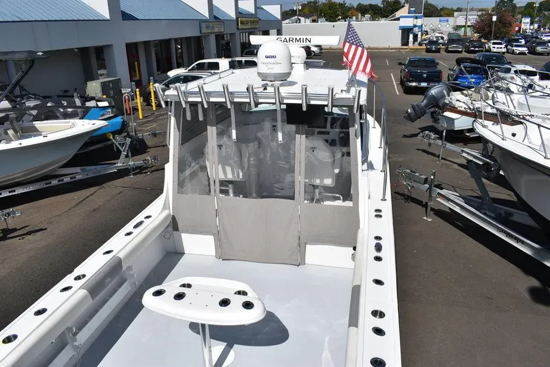 Slide: The Image of 2023 Steiger Craft 31 Miami boat docked, featuring spacious deck and modern equipment. - 18