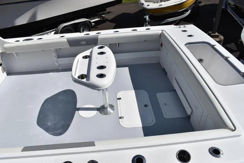 Slide: The Image of 2023 Steiger Craft 31 Miami boat deck with rod holders and storage compartments. - 24