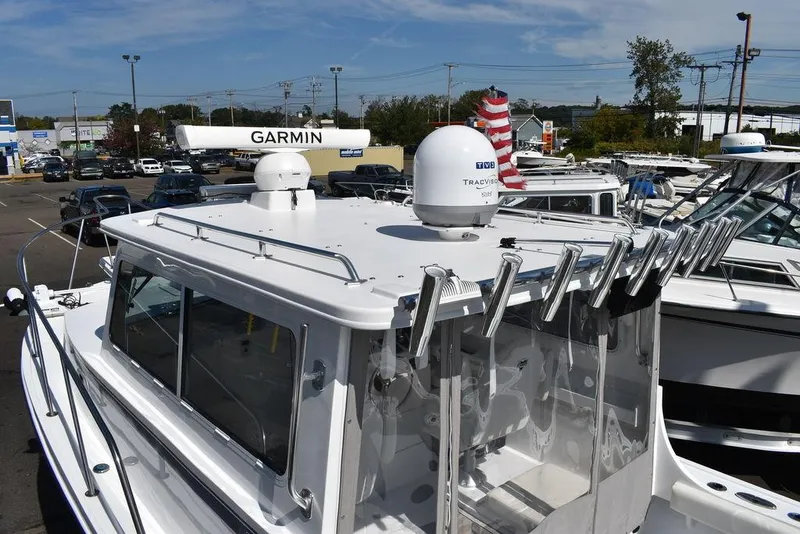 Slide: The Image of 2023 Steiger Craft 31 Miami boat with Garmin radar and rod holders. - 26