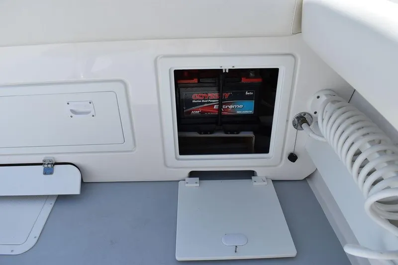 Slide: The Image of 2023 Steiger Craft 31 Miami boat battery compartment with storage access. - 40