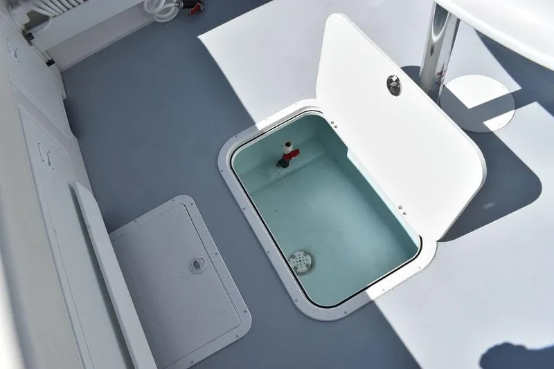 Slide: The Image of 2023 Steiger Craft 31 Miami boat deck with open storage compartment. - 46