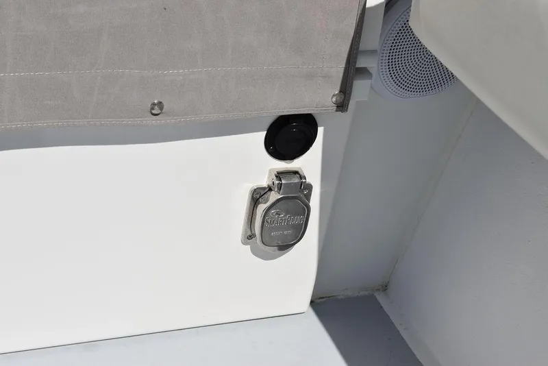 Slide: The Image of 2023 Steiger Craft 31 Miami boat detail, featuring a power outlet and speaker. - 48