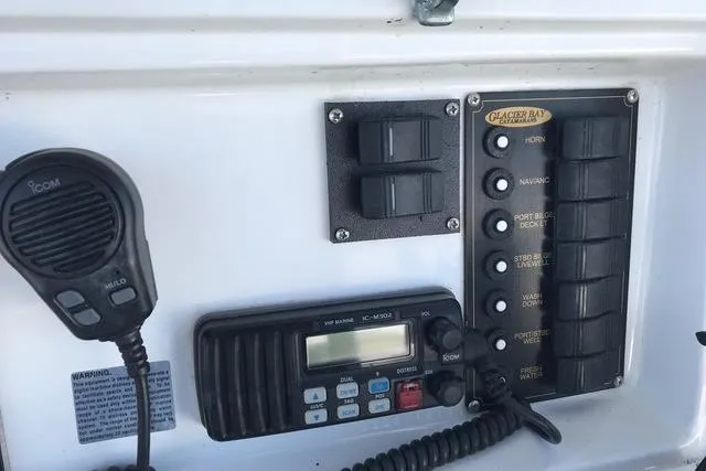 Slide: The Image of Control panel of 2005 Glacier Bay 260 Canyon Runner with radio and switches. - 10