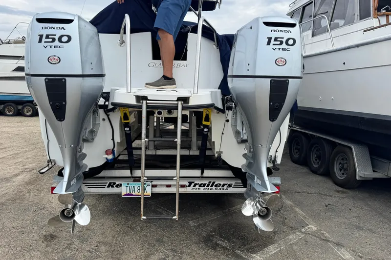 Slide: The Image of 2005 Glacier Bay 260 Canyon Runner with dual Honda 150 VTEC outboard motors. - 15