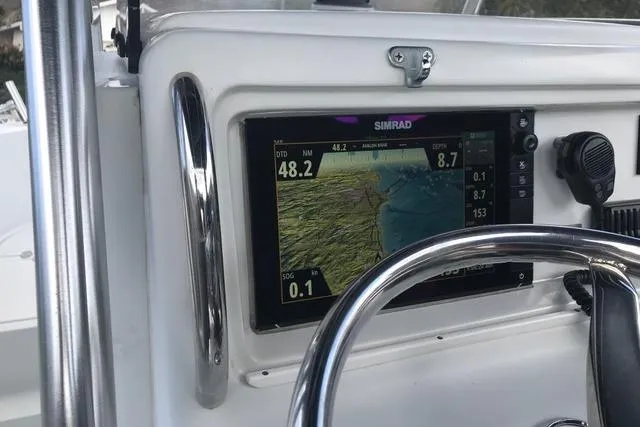 Slide: The Image of 2005 Glacier Bay 260 Canyon Runner dashboard with Simrad navigation display. - 9
