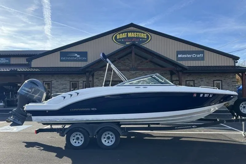The Image of 2022 Chaparral 23 SSi OB boat on trailer outside dealership. - 1
