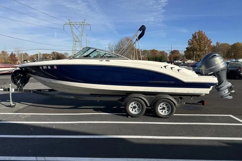 Slide: The Image of 2022 Chaparral 23 SSi OB boat on trailer, parked outdoors. - 10