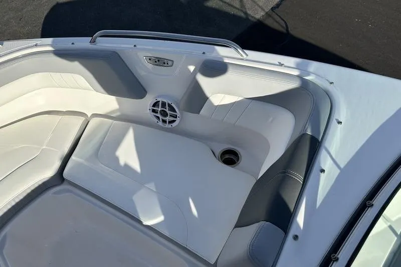Slide: The Image of 2022 Chaparral 23 SSi OB boat interior with white seating and speaker. - 24