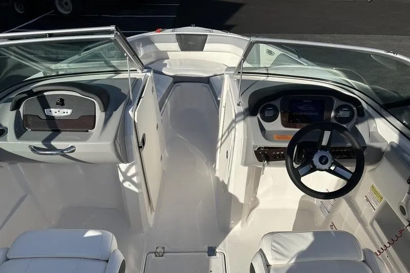 Slide: The Image of 2022 Chaparral 23 SSi OB boat interior with steering wheel and seating. - 25