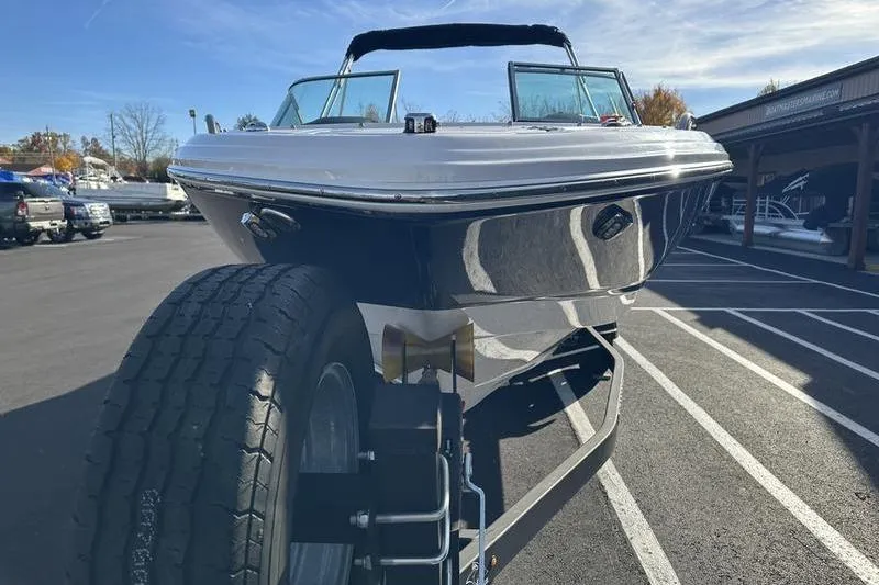 Slide: The Image of 2022 Chaparral 23 SSi OB boat on trailer, parked outdoors. - 3