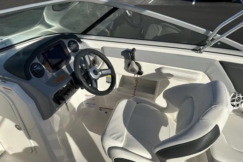 Slide: The Image of Interior view of 2022 Chaparral 23 SSi OB boat cockpit with steering wheel. - 32
