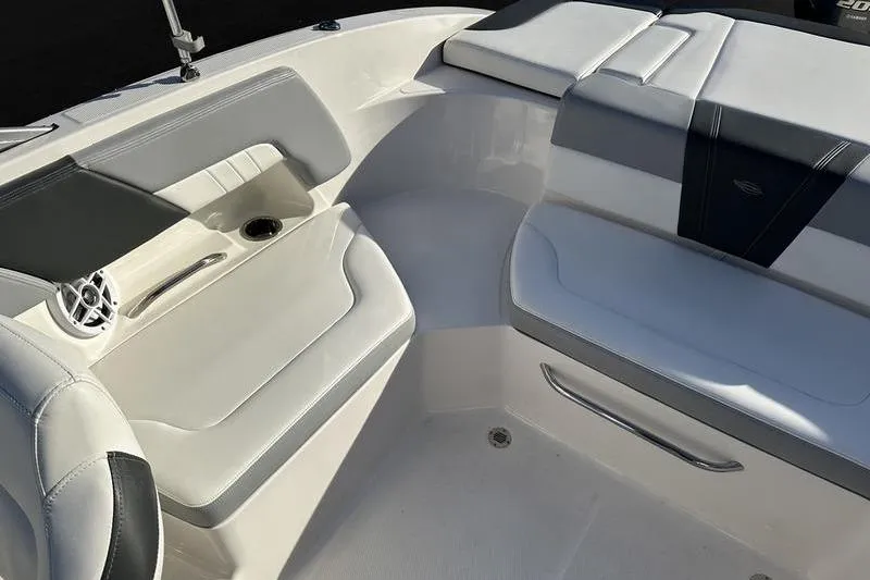 Slide: The Image of 2022 Chaparral 23 SSi OB boat interior with cushioned seating and speaker. - 33