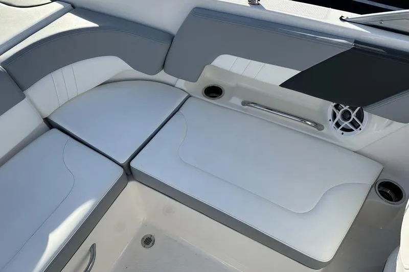 Slide: The Image of 2022 Chaparral 23 SSi OB boat interior seating with gray and white upholstery. - 34