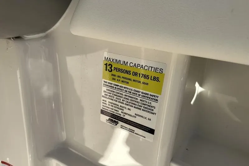 Slide: The Image of 2022 Chaparral 23 SSi OB capacity label: 13 persons or 1765 lbs maximum. - 36