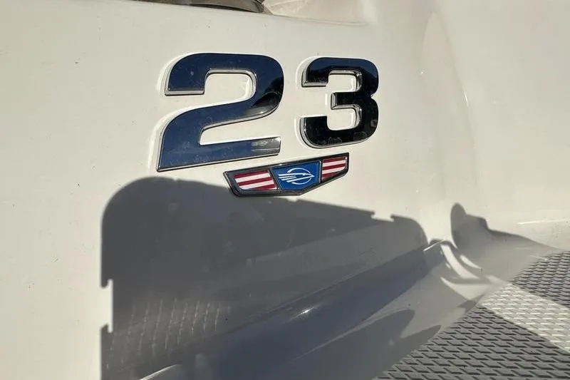 Slide: The Image of 2022 Chaparral 23 SSi OB boat emblem on white surface. - 40