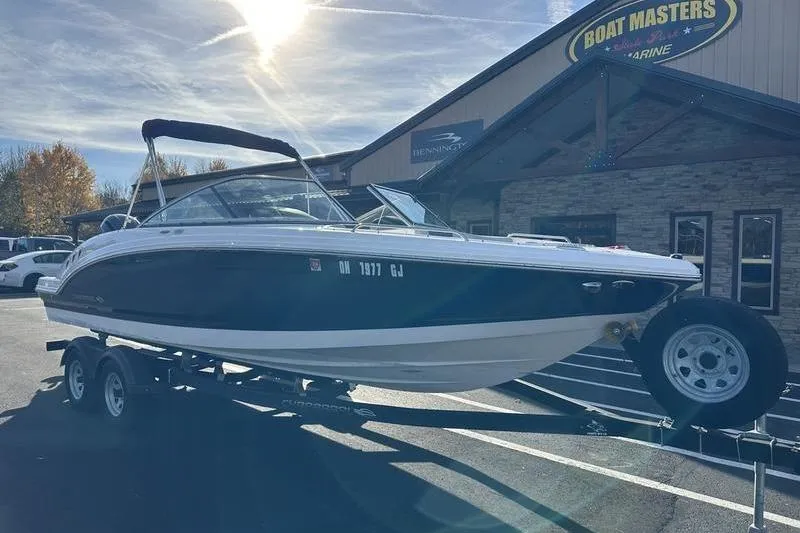 Slide: The Image of 2022 Chaparral 23 SSi OB boat on trailer outside dealership. - 6