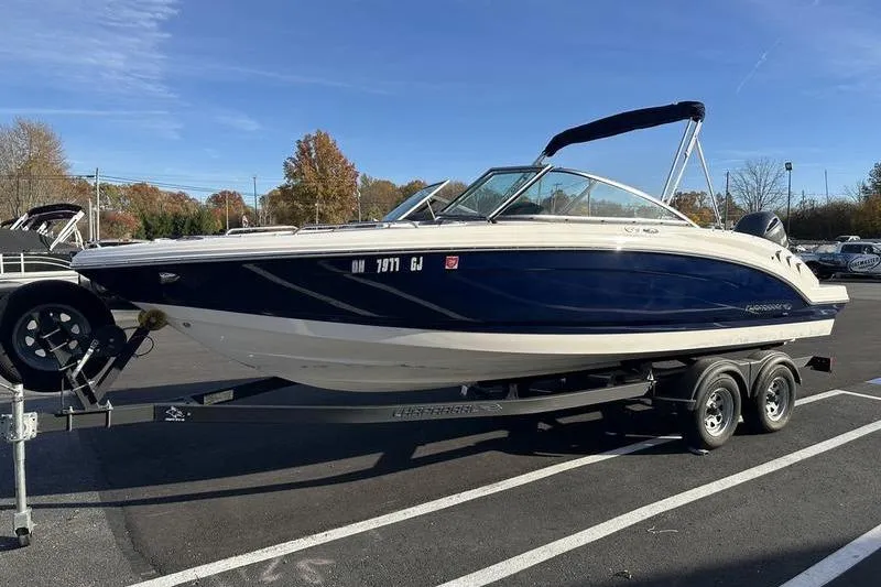 Slide: The Image of 2022 Chaparral 23 SSi OB boat on trailer in parking lot, sunny day. - 8