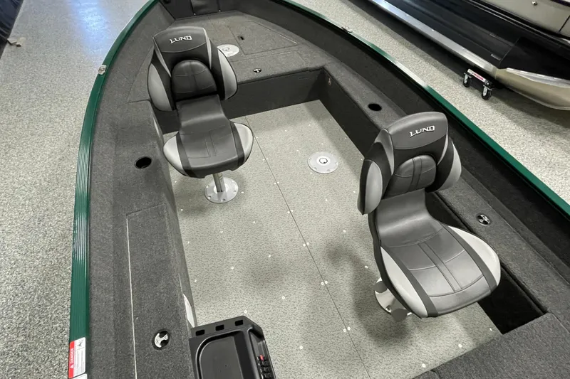 Slide: The Image of 2025 Lund 1650 Angler Tiller boat interior with two swivel seats. - 10