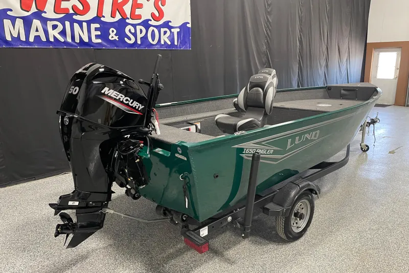 Slide: The Image of 2025 Lund 1650 Angler Tiller boat with Mercury engine in showroom. - 3