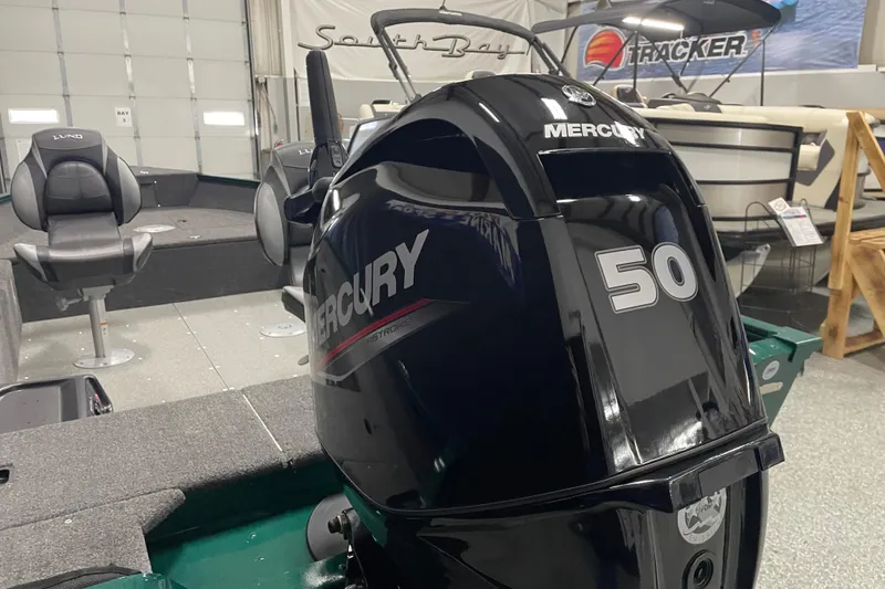 Slide: The Image of 2025 Lund 1650 Angler Tiller with Mercury 50 outboard motor in showroom. - 5