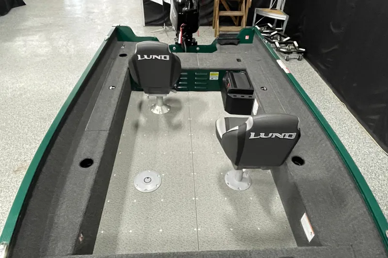 Slide: The Image of 2025 Lund 1650 Angler Tiller boat interior with two seats and spacious layout. - 8