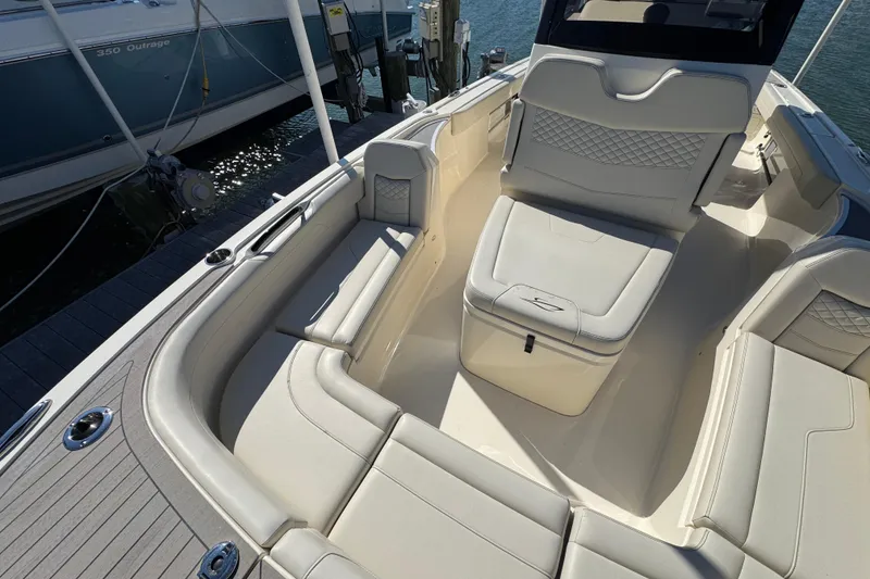 Slide: The Image of 2025 Scout 281 XSS boat interior with luxurious seating and modern design. - 11
