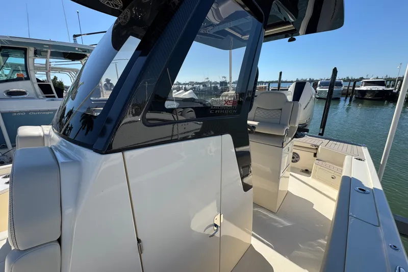 Slide: The Image of 2025 Scout 281 XSS boat docked, showcasing sleek design and modern features. - 13