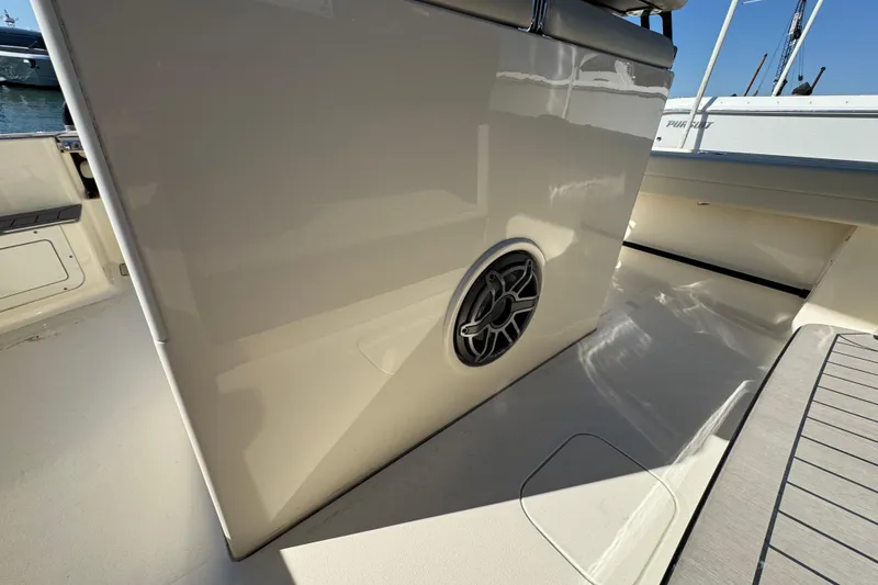 Slide: The Image of 2025 Scout 281 XSS boat interior with speaker detail, showcasing sleek design and craftsmanship. - 19