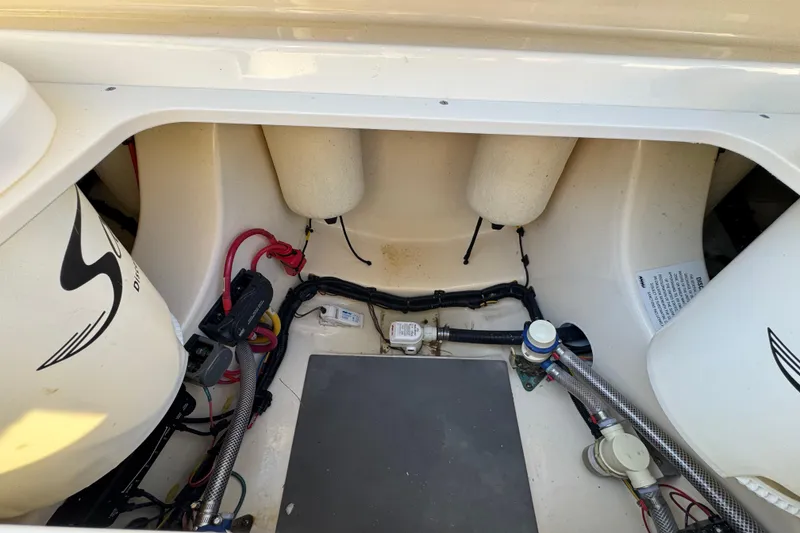 Slide: The Image of 2025 Scout 281 XSS boat interior showing wiring and components. - 31
