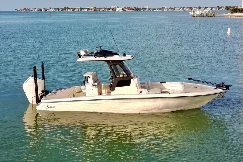 Slide: The Image of 2025 Scout 281 XSS boat on calm water, showcasing sleek design and modern features. - 47