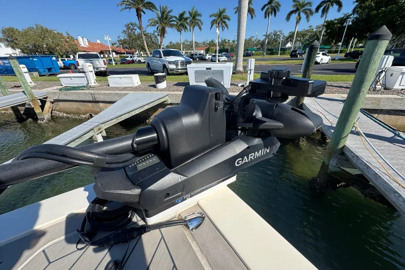 Slide: The Image of 2025 Scout 281 XSS boat with Garmin equipment at a dockside marina. - 6