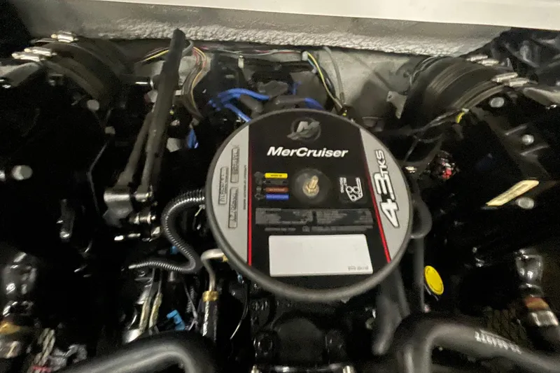 Slide: The Image of 2010 Glastron GT 185 boat dashboard with wood-accented steering wheel and modern gauges. - 10