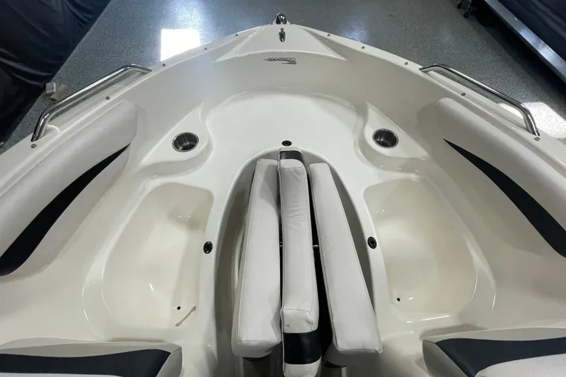 Slide: The Image of 2010 Glastron GT 185 boat interior storage compartment with carpeted flooring. - 16