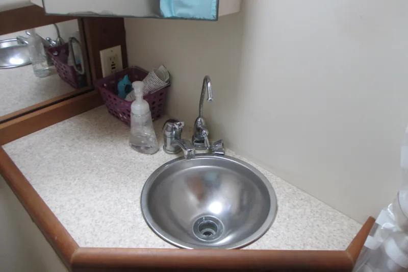 Slide: The Image of Small bathroom sink in 2005 Mainship Pilot 34 Sedan boat. - 33