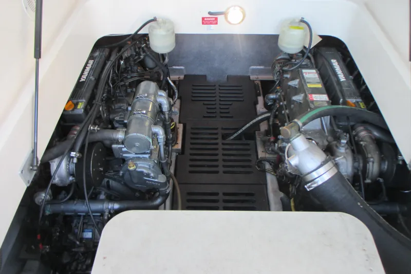 Slide: The Image of Engine compartment of a 2005 Mainship Pilot 34 Sedan with dual Yanmar engines. - 35
