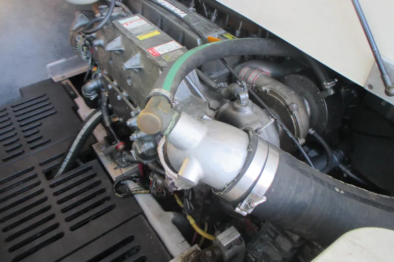 Slide: The Image of Engine compartment of a 2005 Mainship Pilot 34 Sedan boat, showcasing mechanical components. - 36