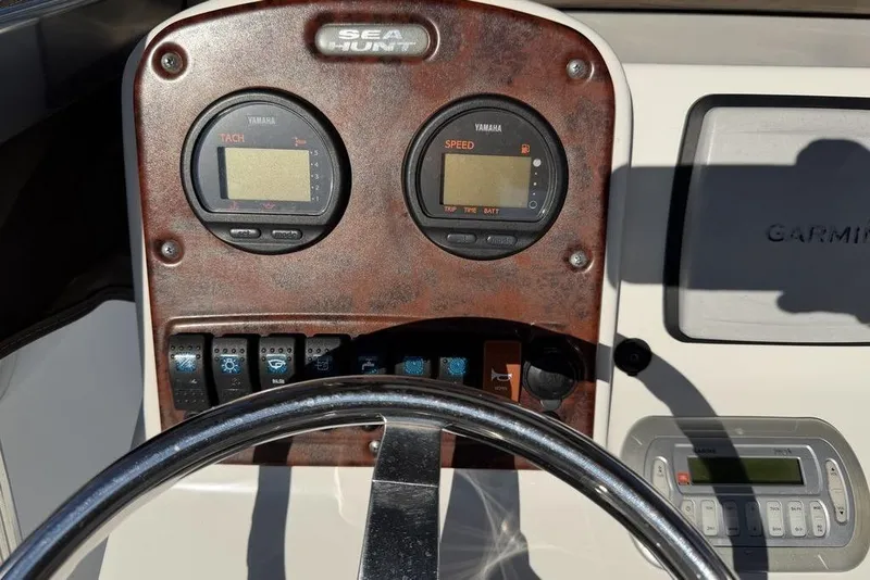 Slide: The Image of Dashboard of a 2010 Sea Hunt Ultra 210 boat with Yamaha gauges and Garmin device. - 16
