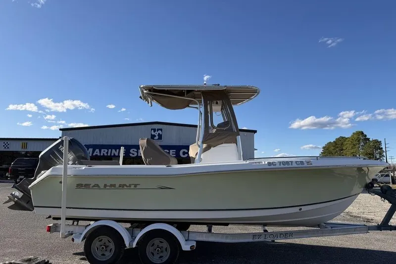 Slide: The Image of 2010 Sea Hunt Ultra 210 boat on trailer at marine service center. - 2
